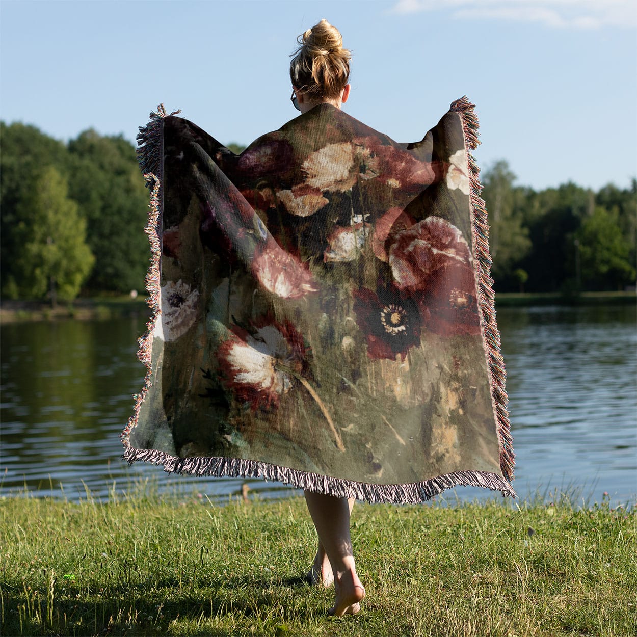 Abstract Flower Woven Throw Blanket Held on a Woman's Back Outside