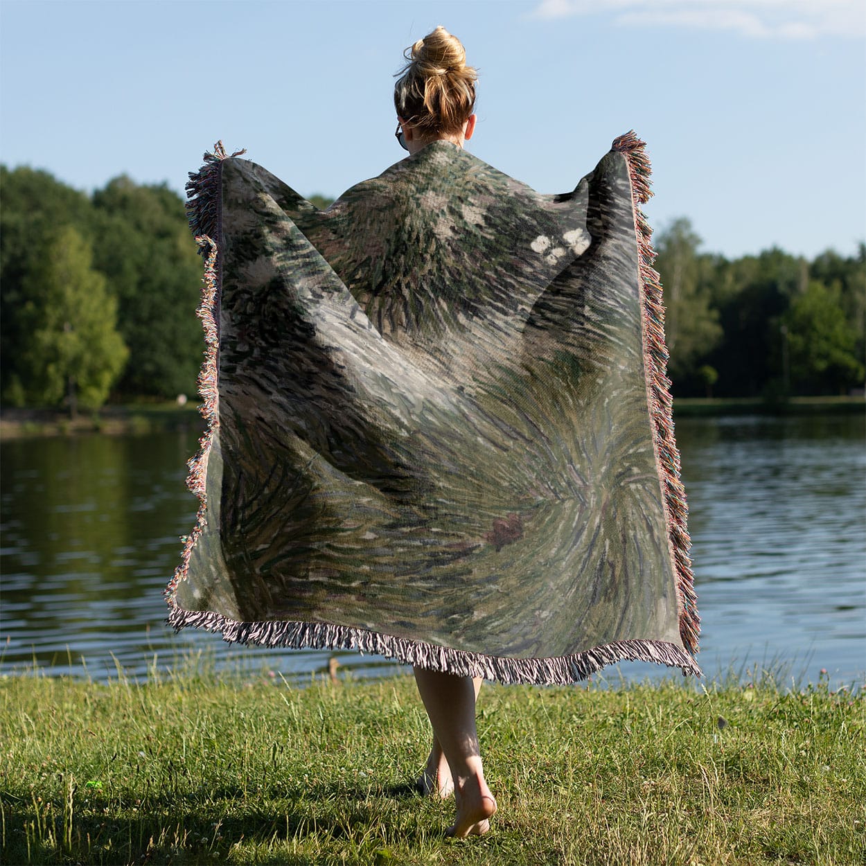 Abstract Garden Woven Throw Blanket Held on a Woman's Back Outside