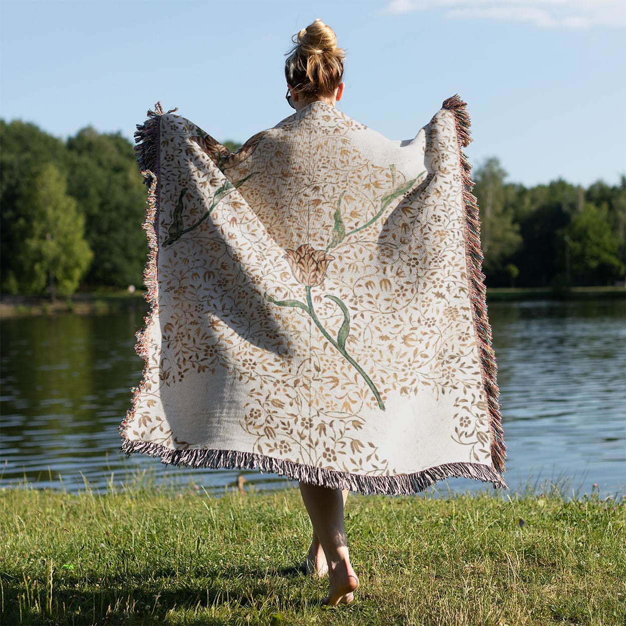 Aesthetic Floral Woven Blanket Held on a Woman's Back Outside