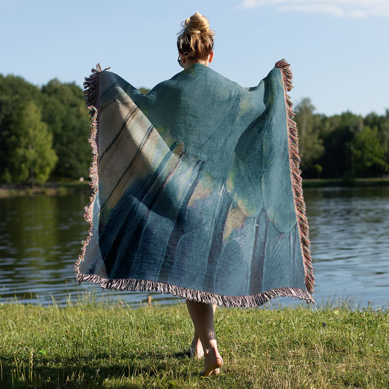 Aesthetic Wing Woven Throw Blanket Held on a Woman's Back Outside