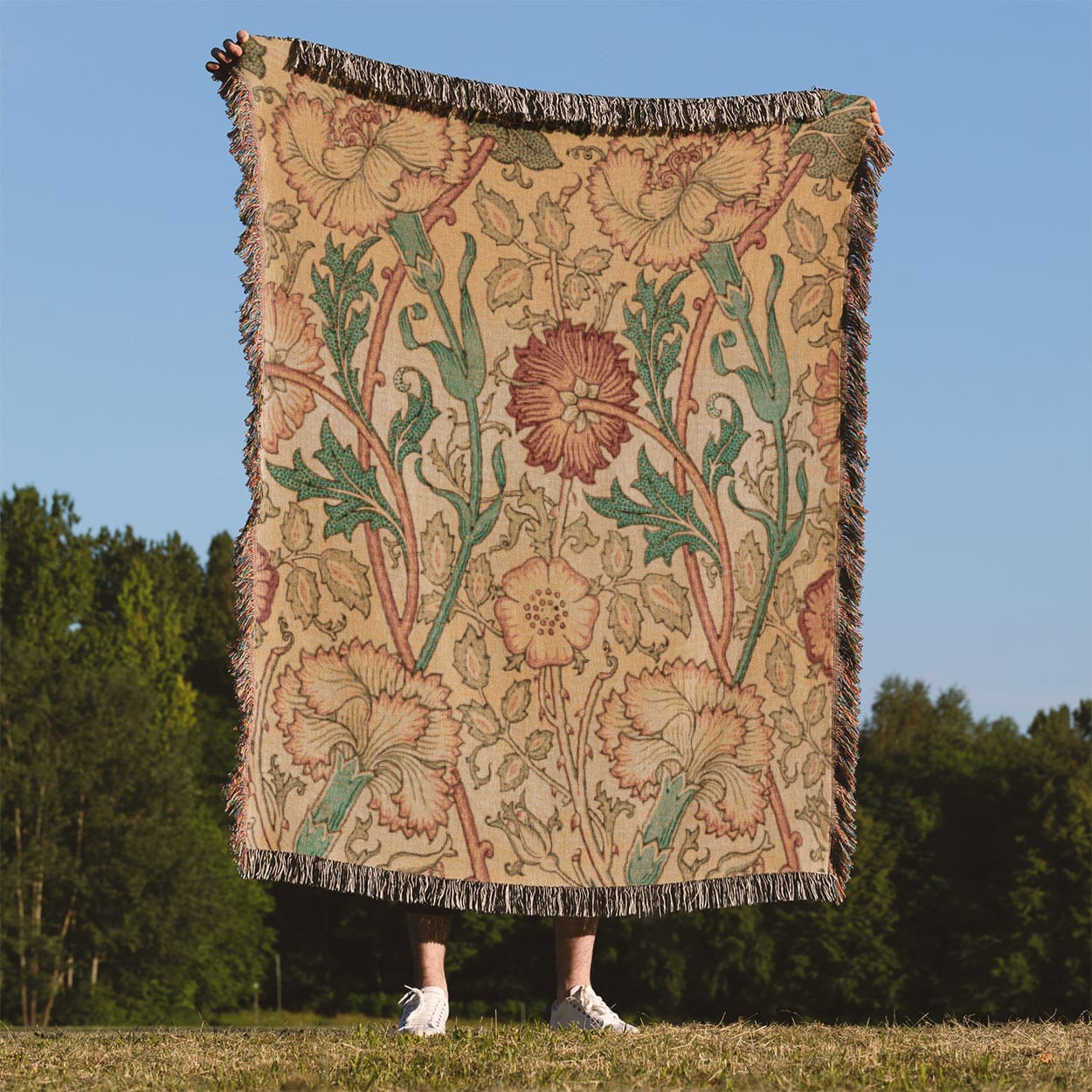 Antique Floral Pattern Woven Blanket Held Up Outside