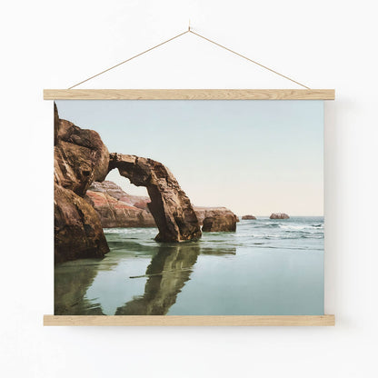 Arch Rock California Coast Art Print in Wood Hanger Frame on Wall