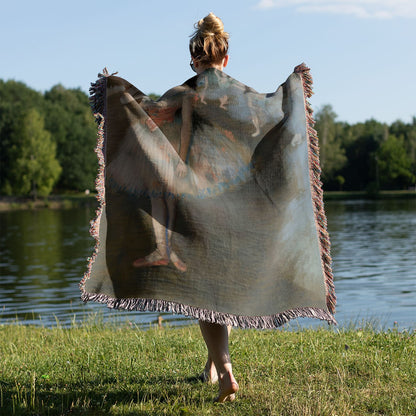 Ballerina Painting Woven Blanket Held on a Woman's Back Outside