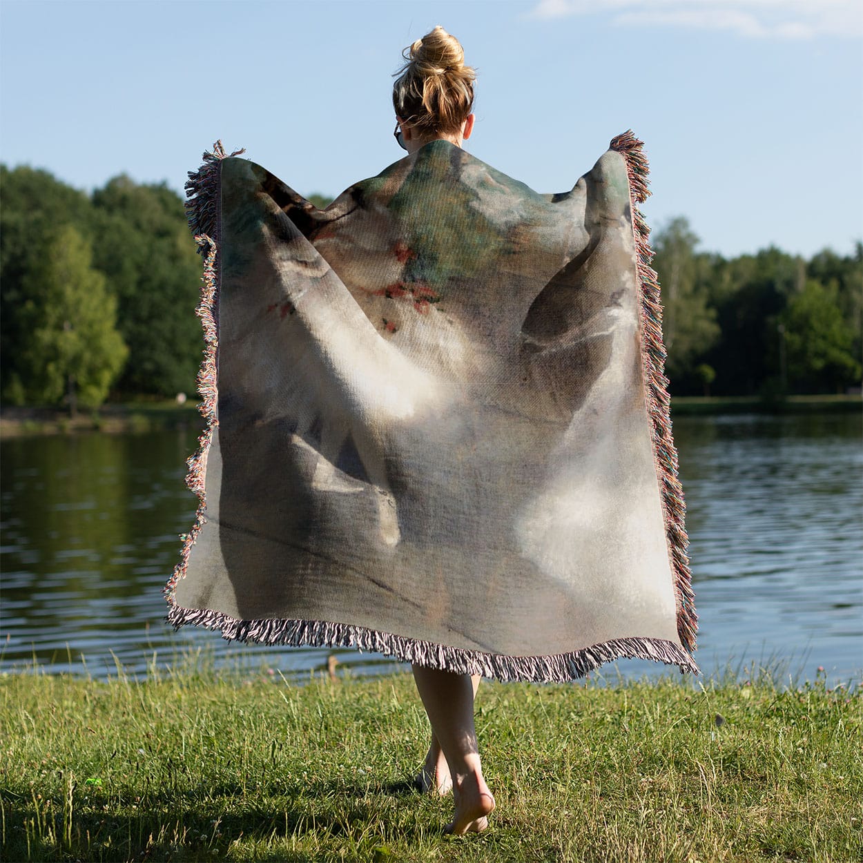 Ballerinas Woven Blanket Held on a Woman's Back Outside