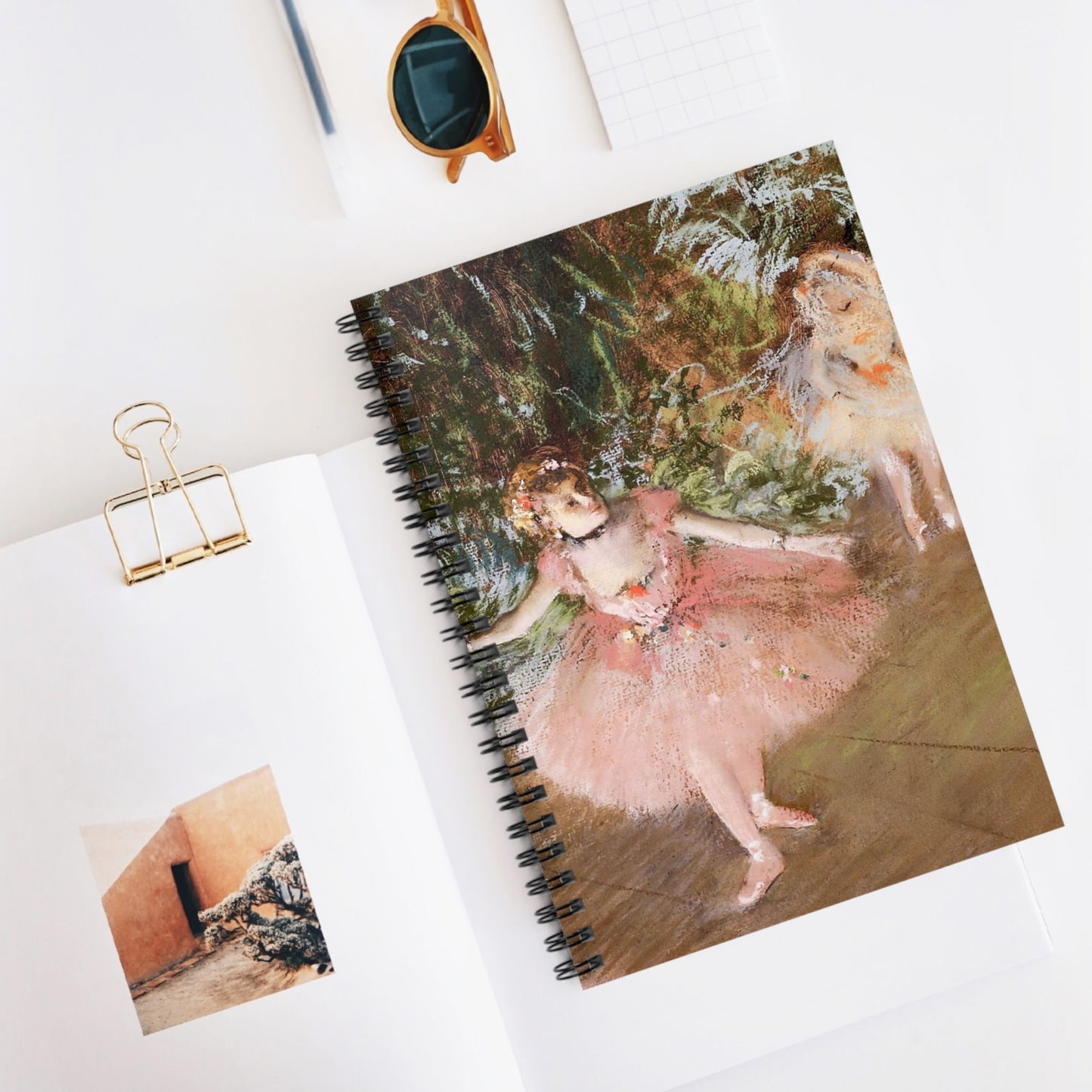 Ballerinas in Pink Spiral Notebook Displayed on Desk