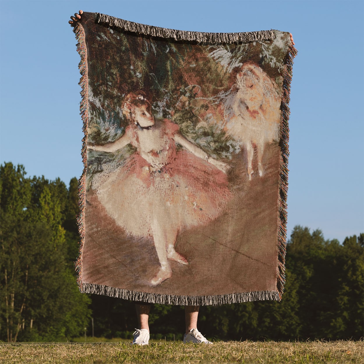 Ballerinas in Pink Woven Blanket Held Up Outside