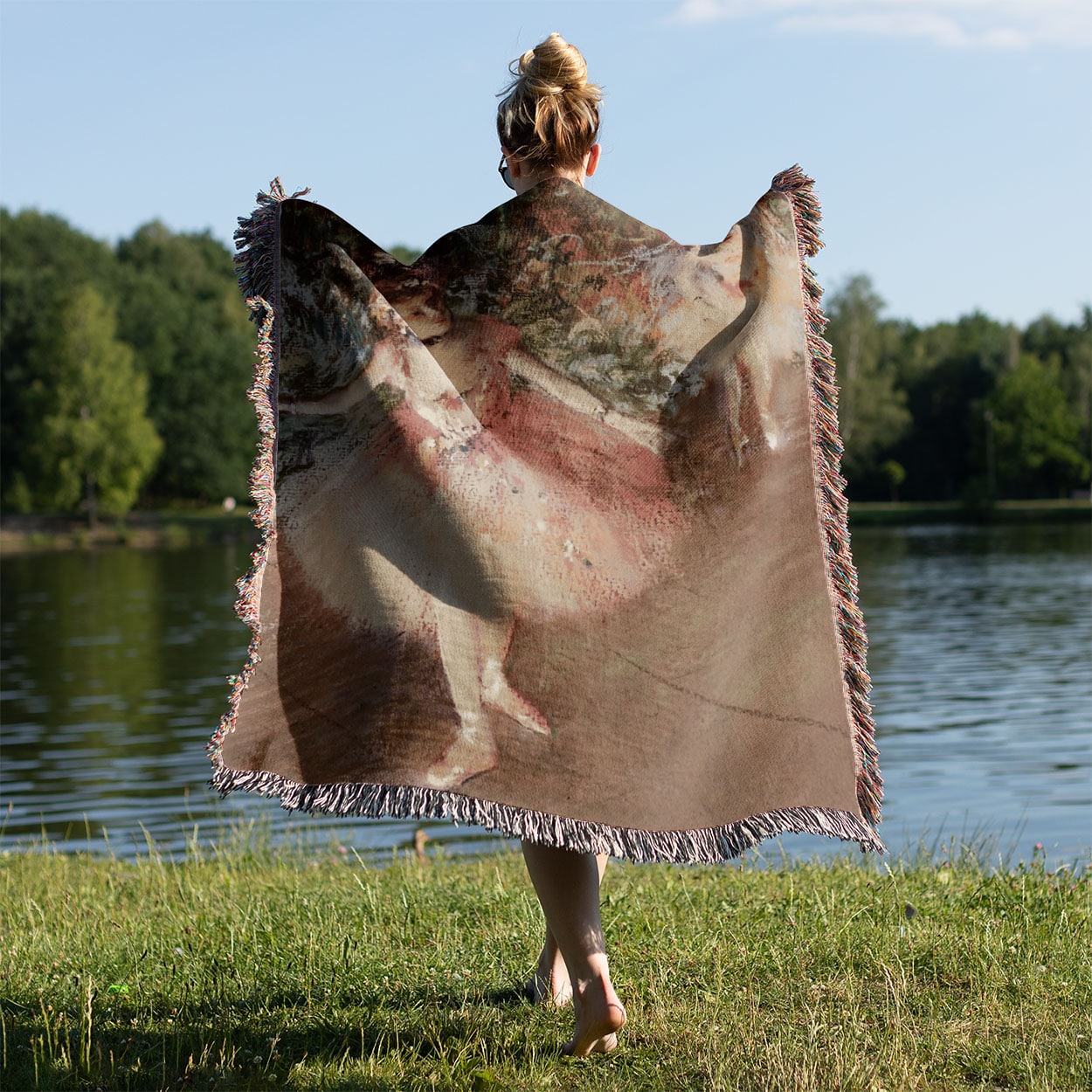 Ballerinas in Pink Woven Blanket Held on a Woman's Back Outside