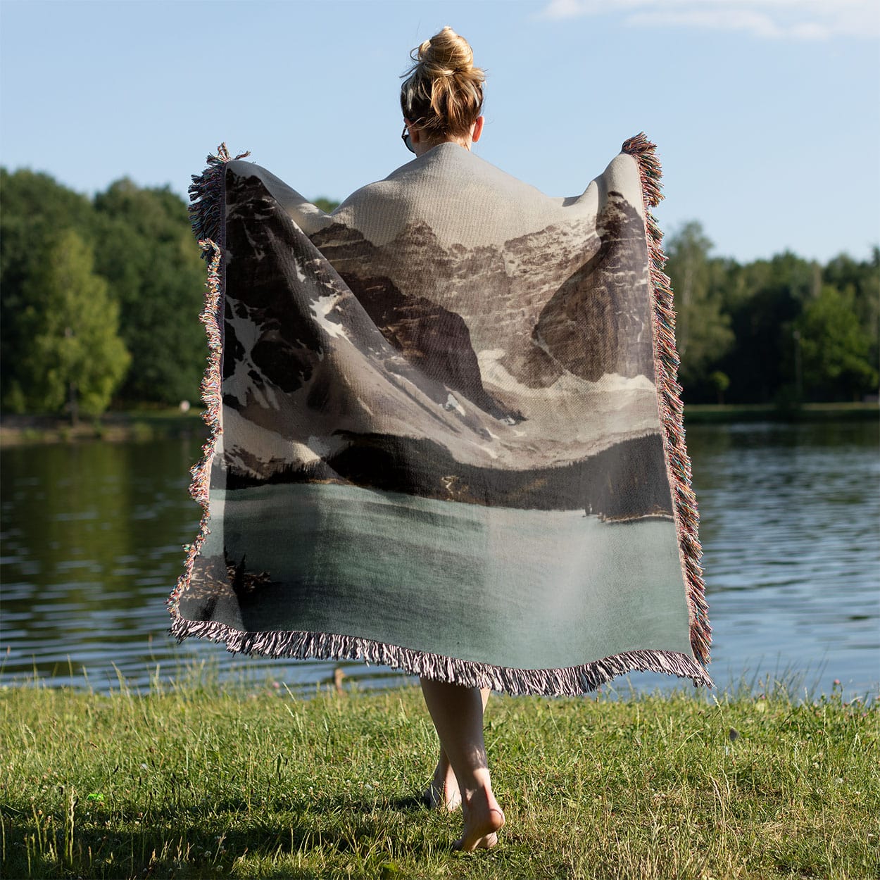 Banff National Park Woven Blanket Held on a Woman's Back Outside