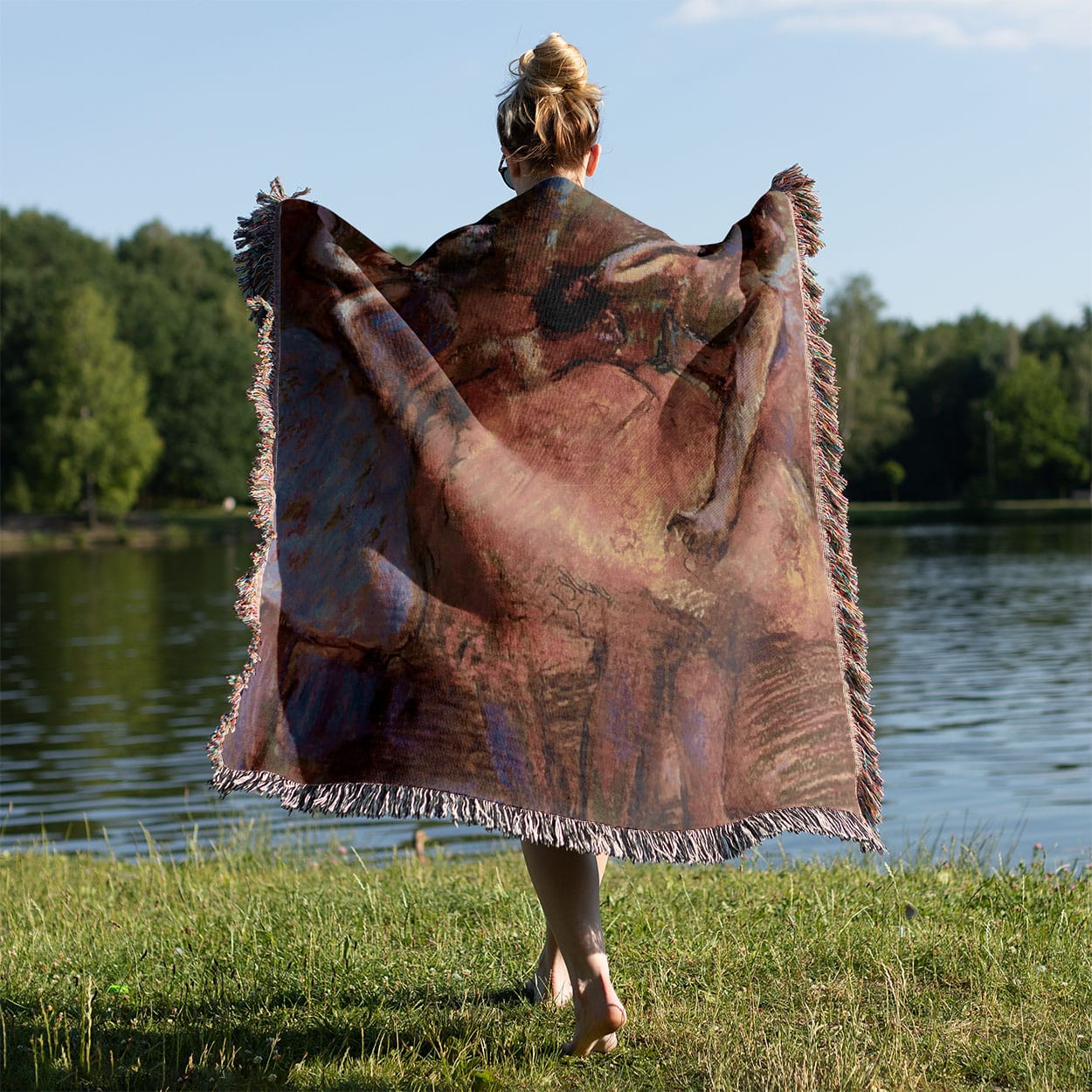 Behind the Curtain Woven Blanket Held on a Woman's Back Outside