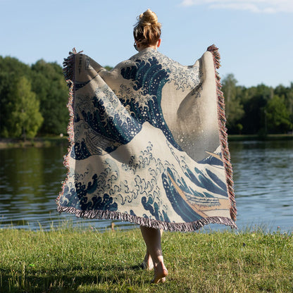 Big Wave Woven Throw Blanket Held on a Woman's Back Outside