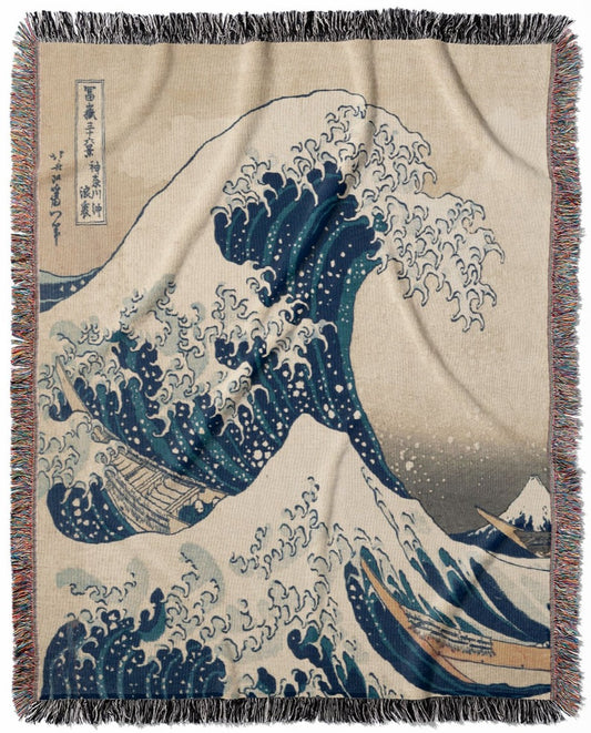 The Great Wave off Kanagawa woven throw blanket, crafted from 100% cotton, offering a soft and cozy texture with a big wave design for home decor.