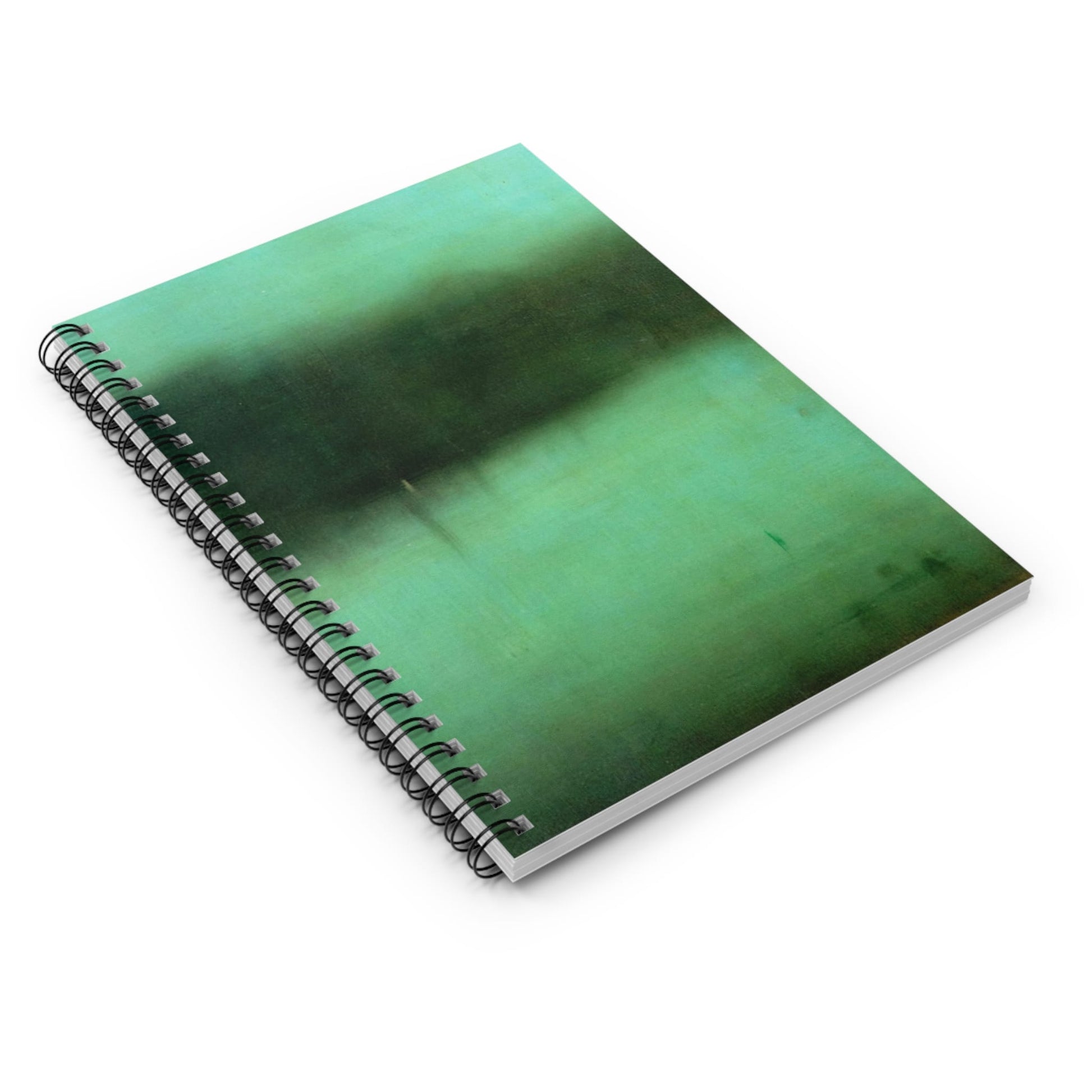 Black and Green Spiral Notebook Laying Flat on White Surface