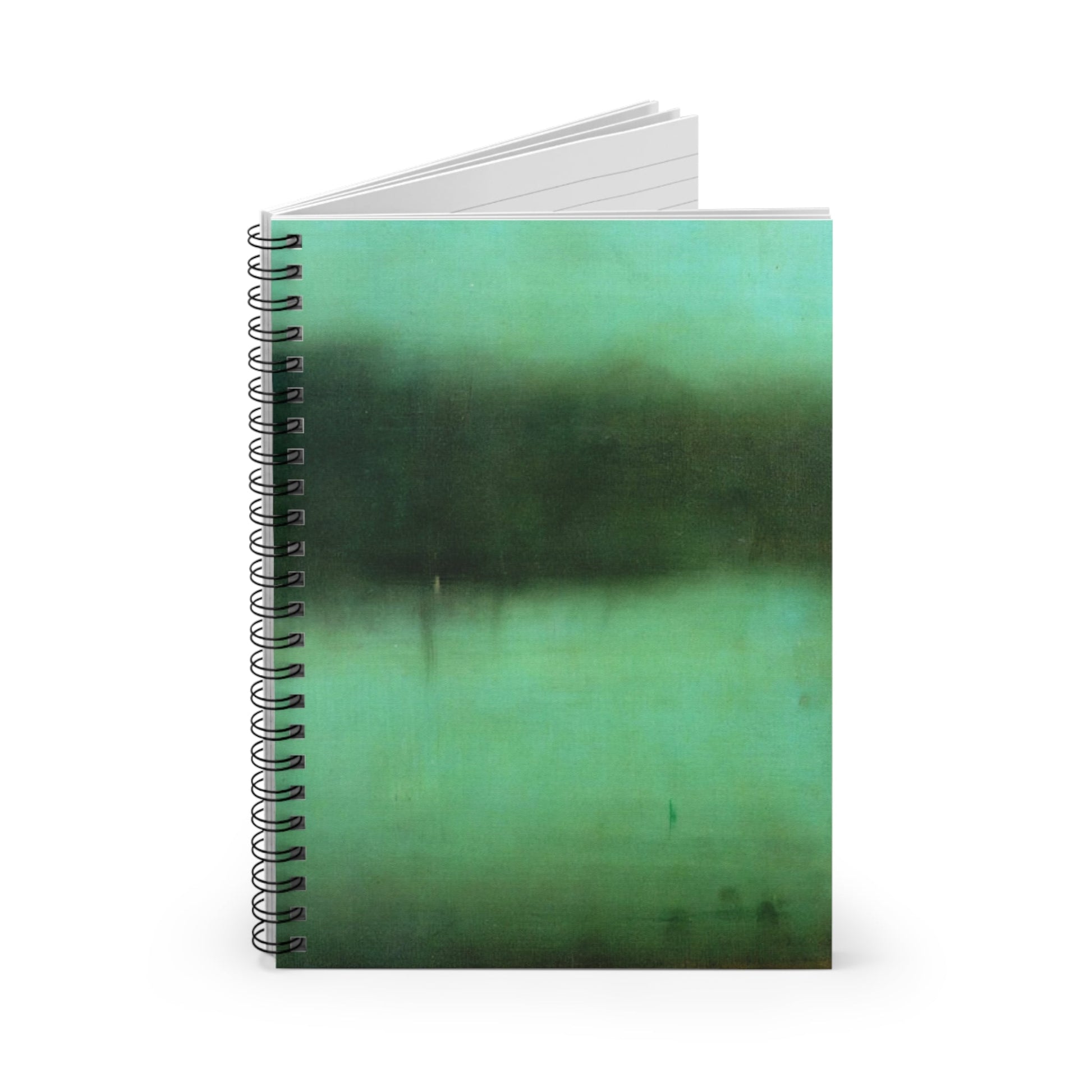 Black and Green Spiral Notebook Standing up on White Desk