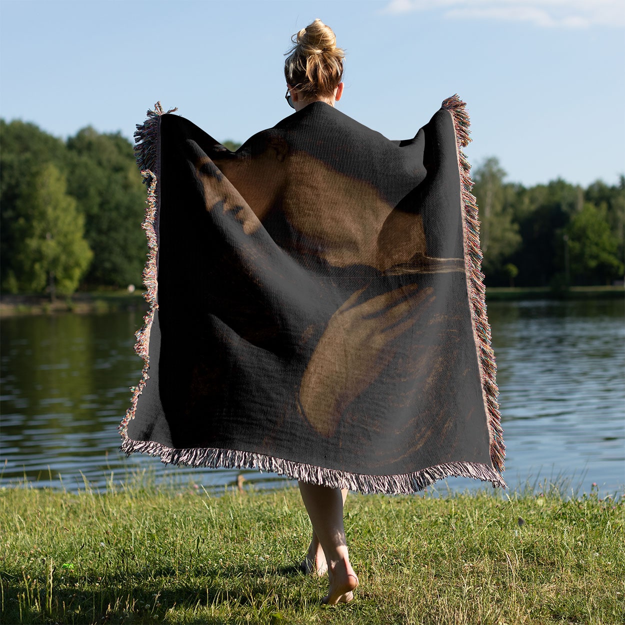 Black and White Moody Woven Blanket Held on a Woman's Back Outside