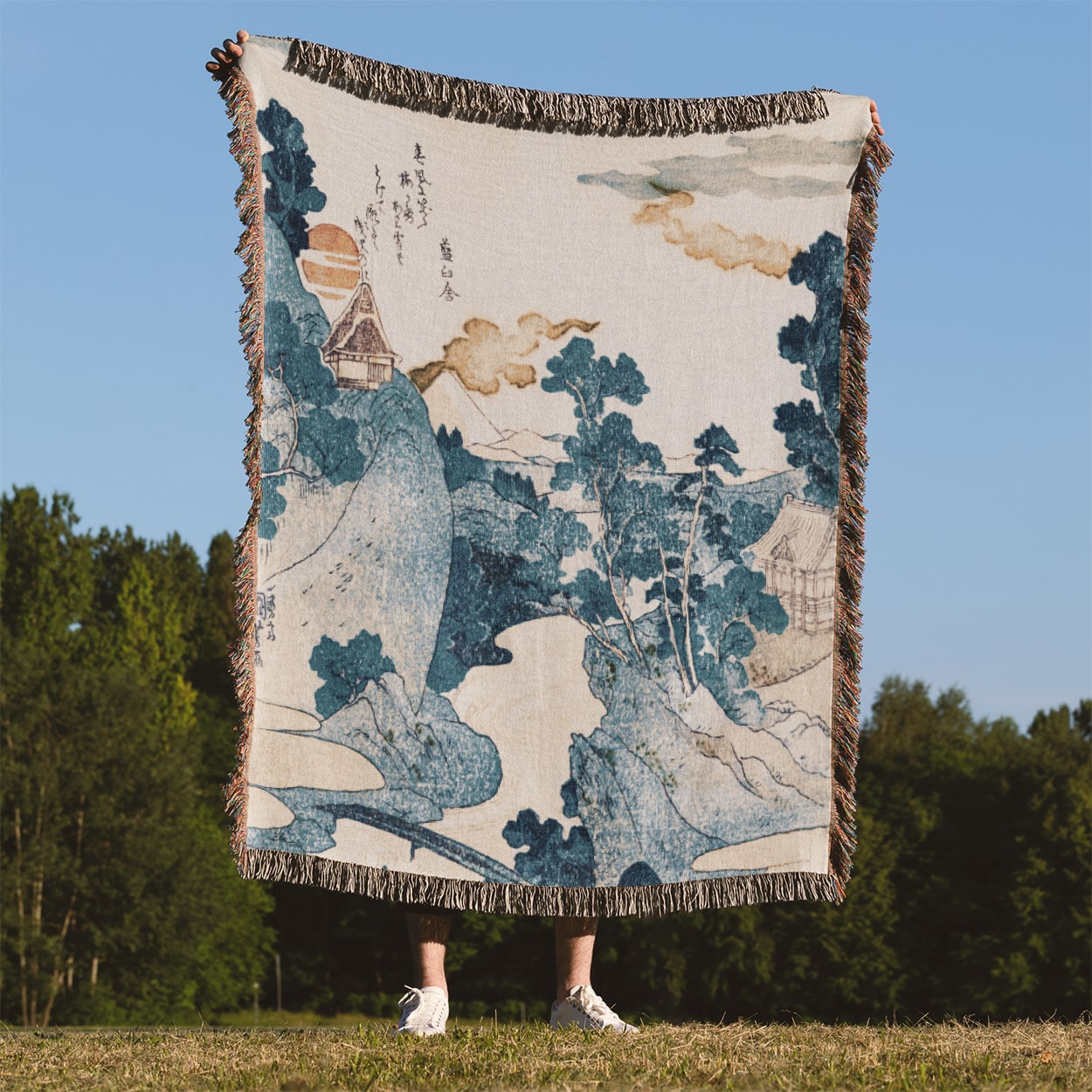 Blue Mountain Landscape Held on a Woman's Back Outside