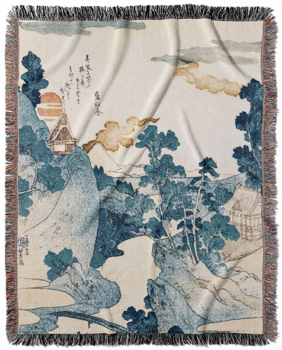 Japanese woven throw blanket, crafted from 100% cotton, offering a soft and cozy texture with a blue mountain landscape design for home decor.