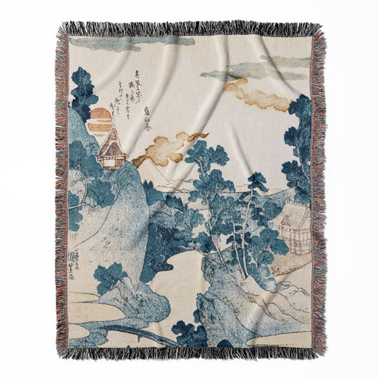 Japanese woven throw blanket, crafted from 100% cotton, offering a soft and cozy texture with a blue mountain landscape design for home decor.
