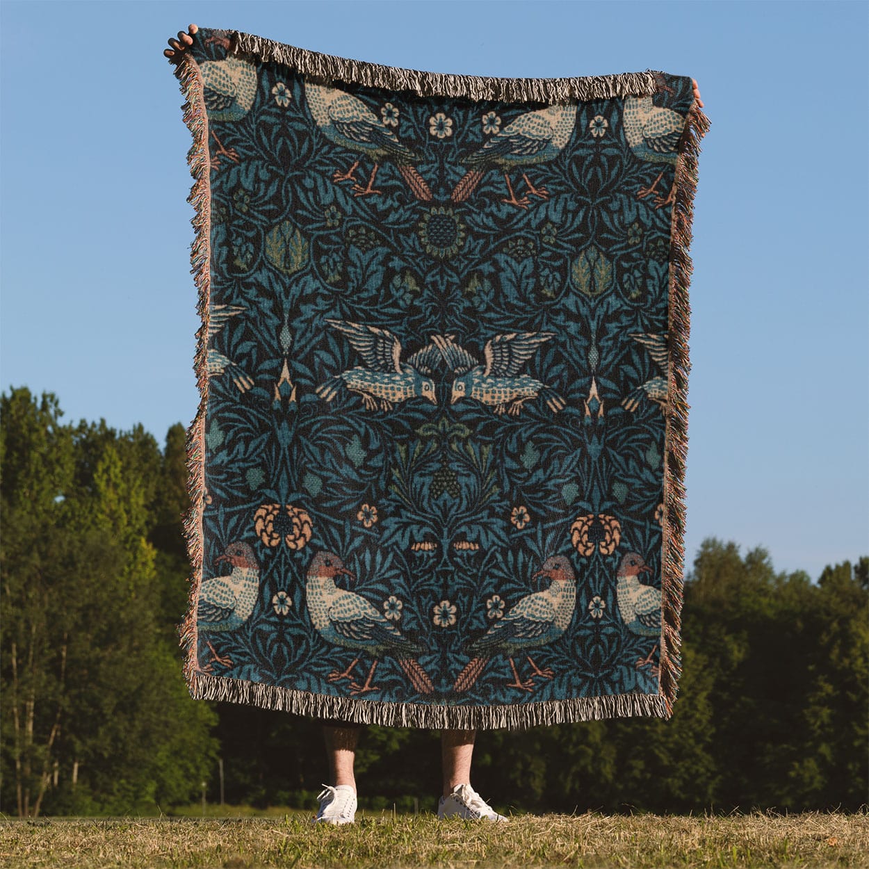 Blue Nature Pattern Woven Throw Blanket Held Up Outside