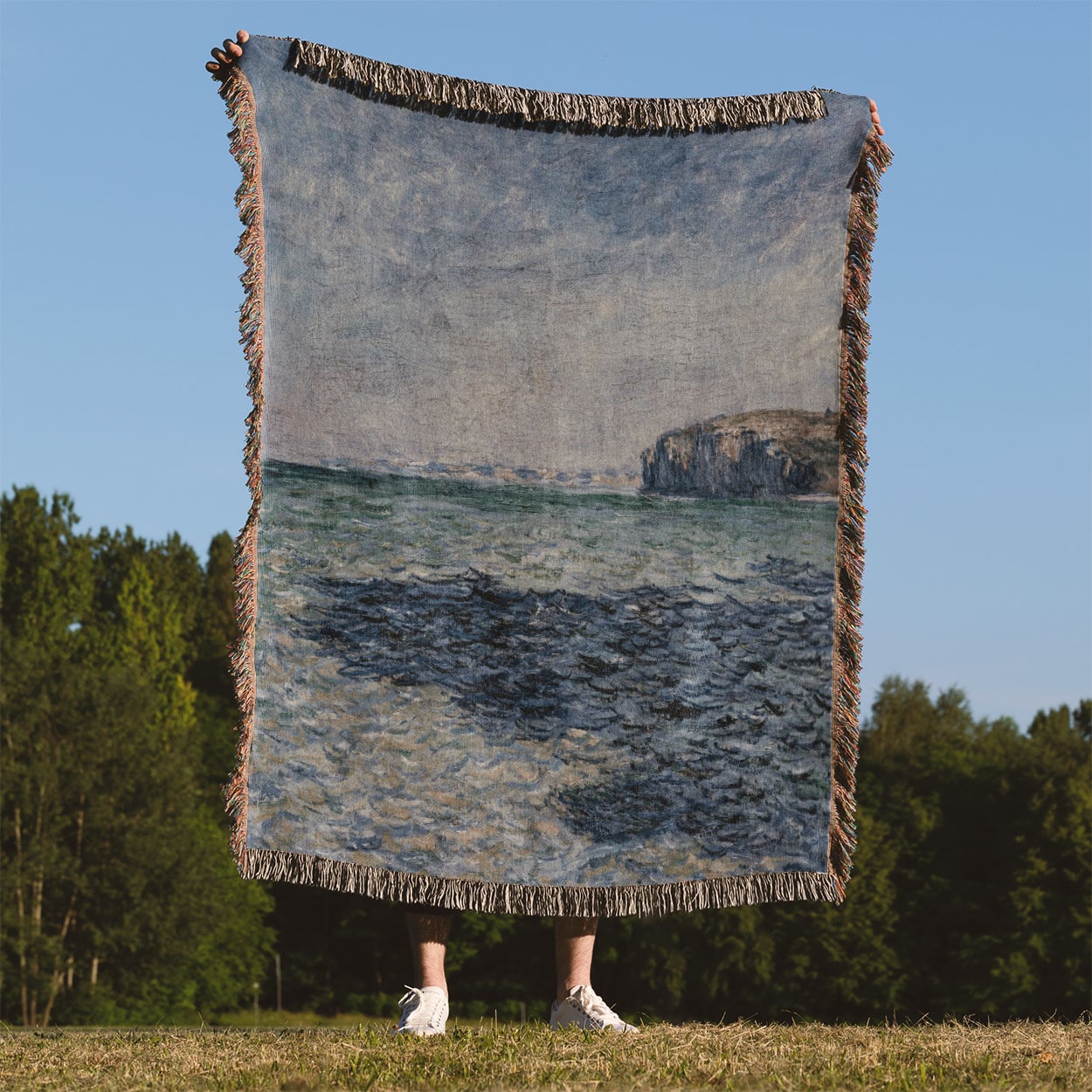 Blue Ocean Woven Blanket Held Up Outside