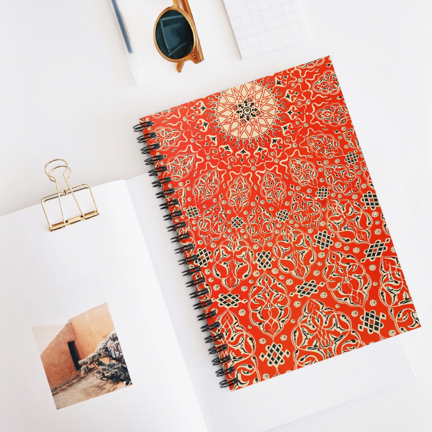 Bright Red Pattern Spiral Notebook Displayed on Desk