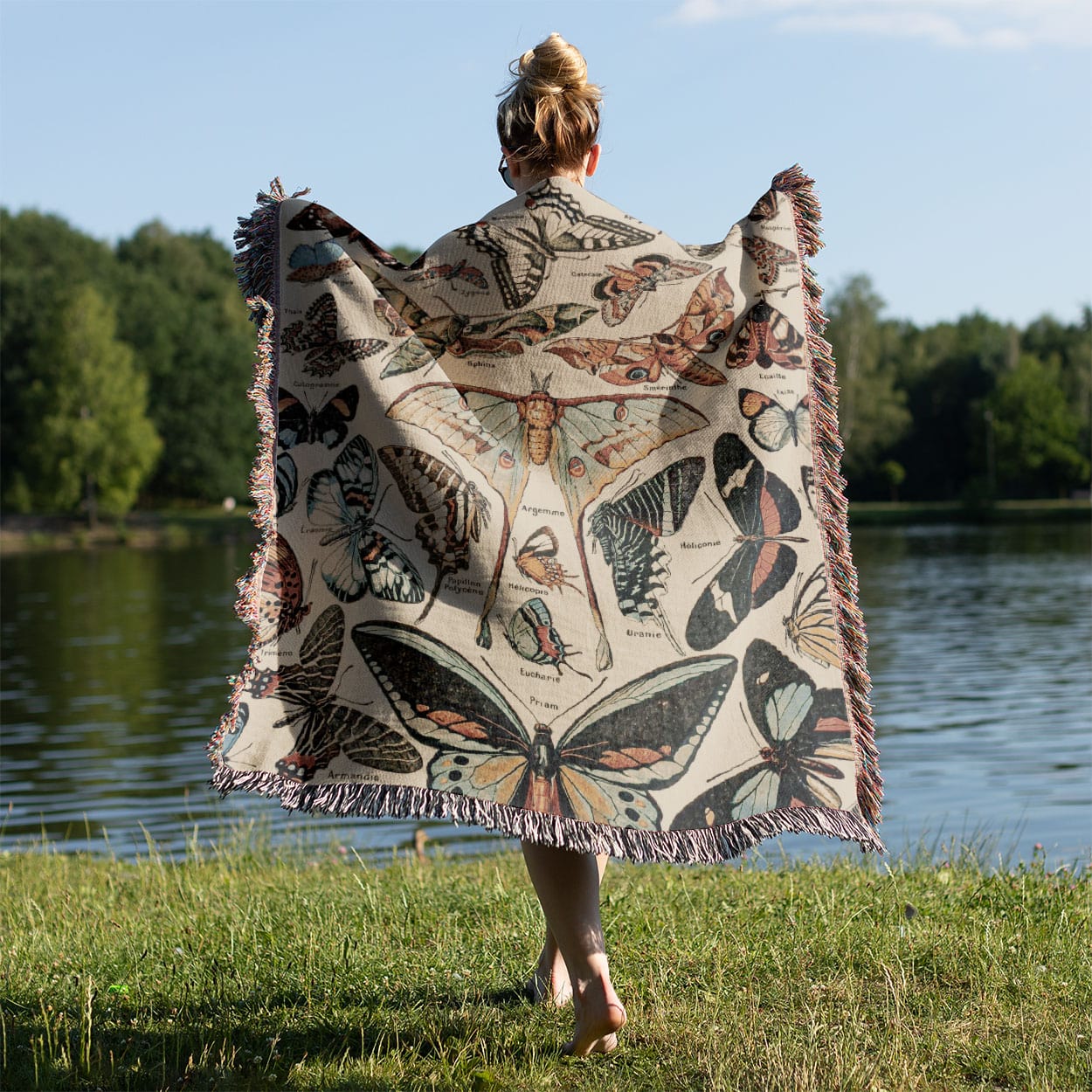 Butterfly Woven Throw Blanket Held on a Woman's Back Outside