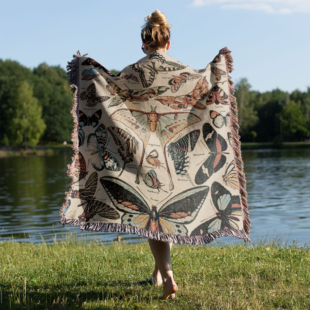 Butterfly Woven Blanket Held on a Woman's Back Outside
