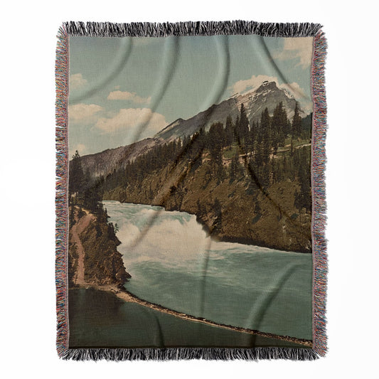 Canada Landscape woven throw blanket, made with 100% cotton, providing a soft and cozy texture with a Banff National Park theme for home decor.