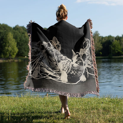 Cats Tangled in Yarn Woven Blanket Held on a Woman's Back Outside