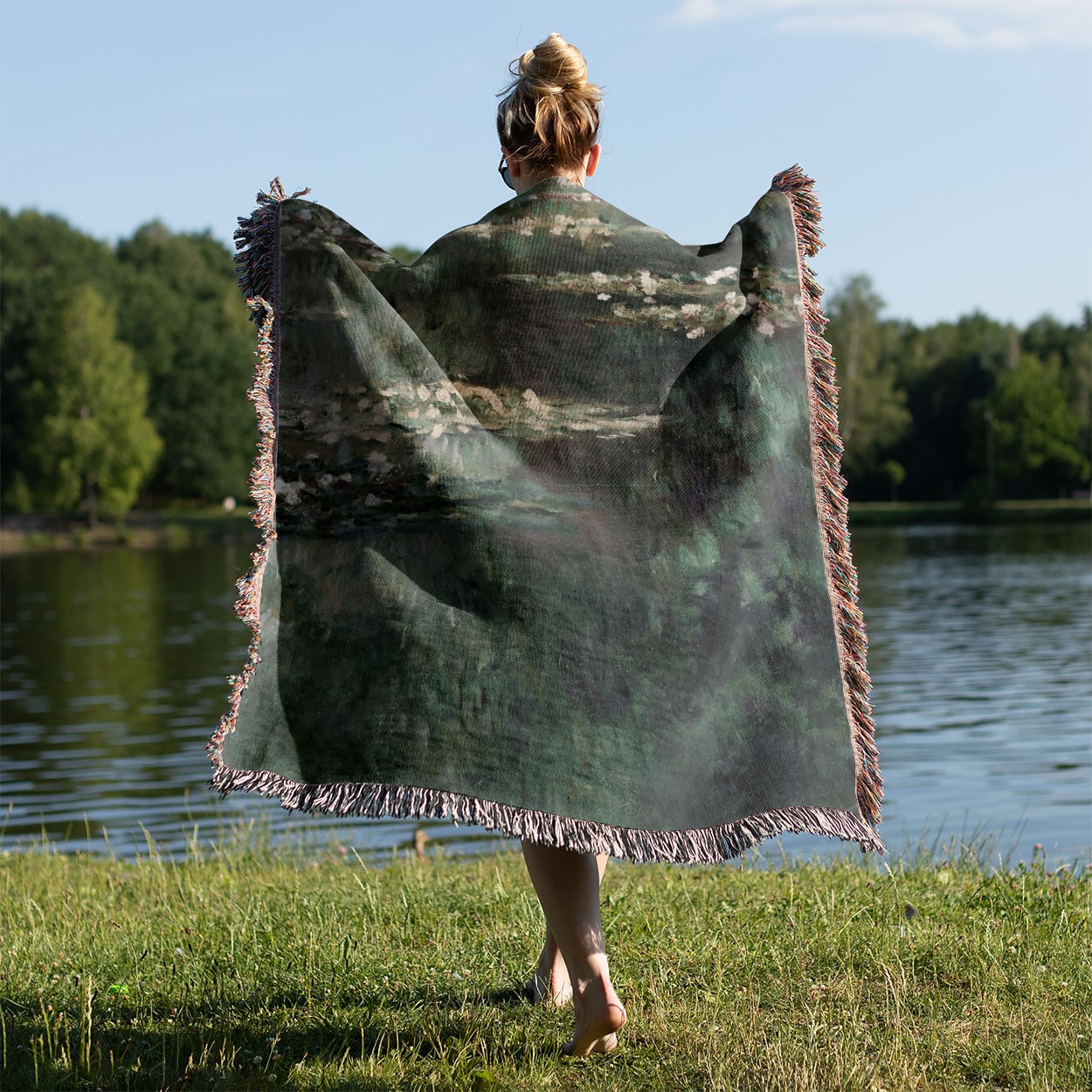 Classical Water Lilies Woven Blanket Held on a Woman's Back Outside