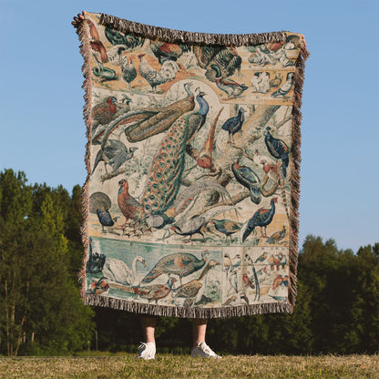 Collection of Birds Woven Throw Blanket Held Up Outside