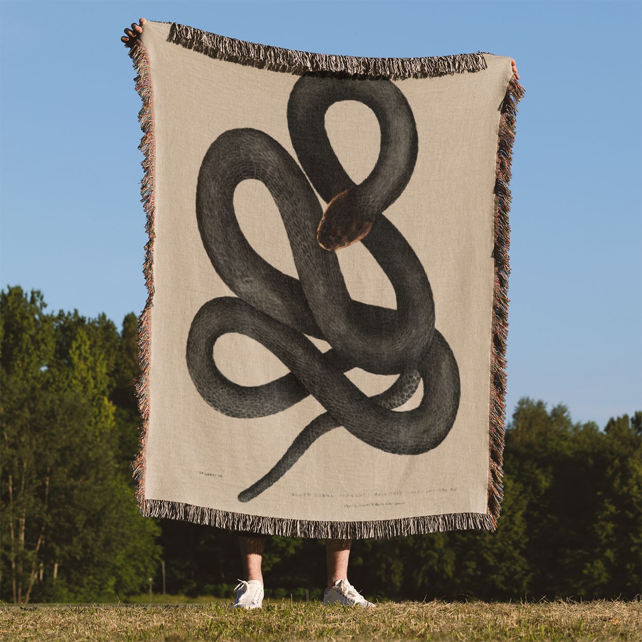 Cool Snake Woven Blanket Held Up Outside