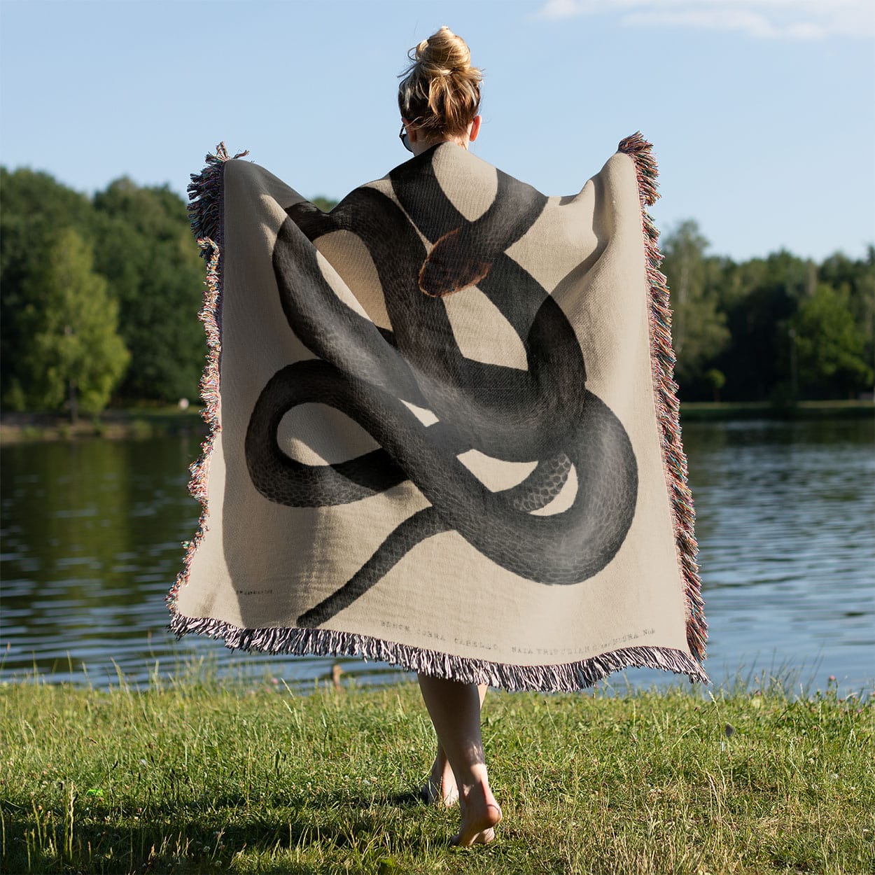 Cool Snake Woven Blanket Held on a Woman's Back Outside