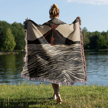 Cool Volcano Drawing Woven Throw Blanket Held on a Woman's Back Outside