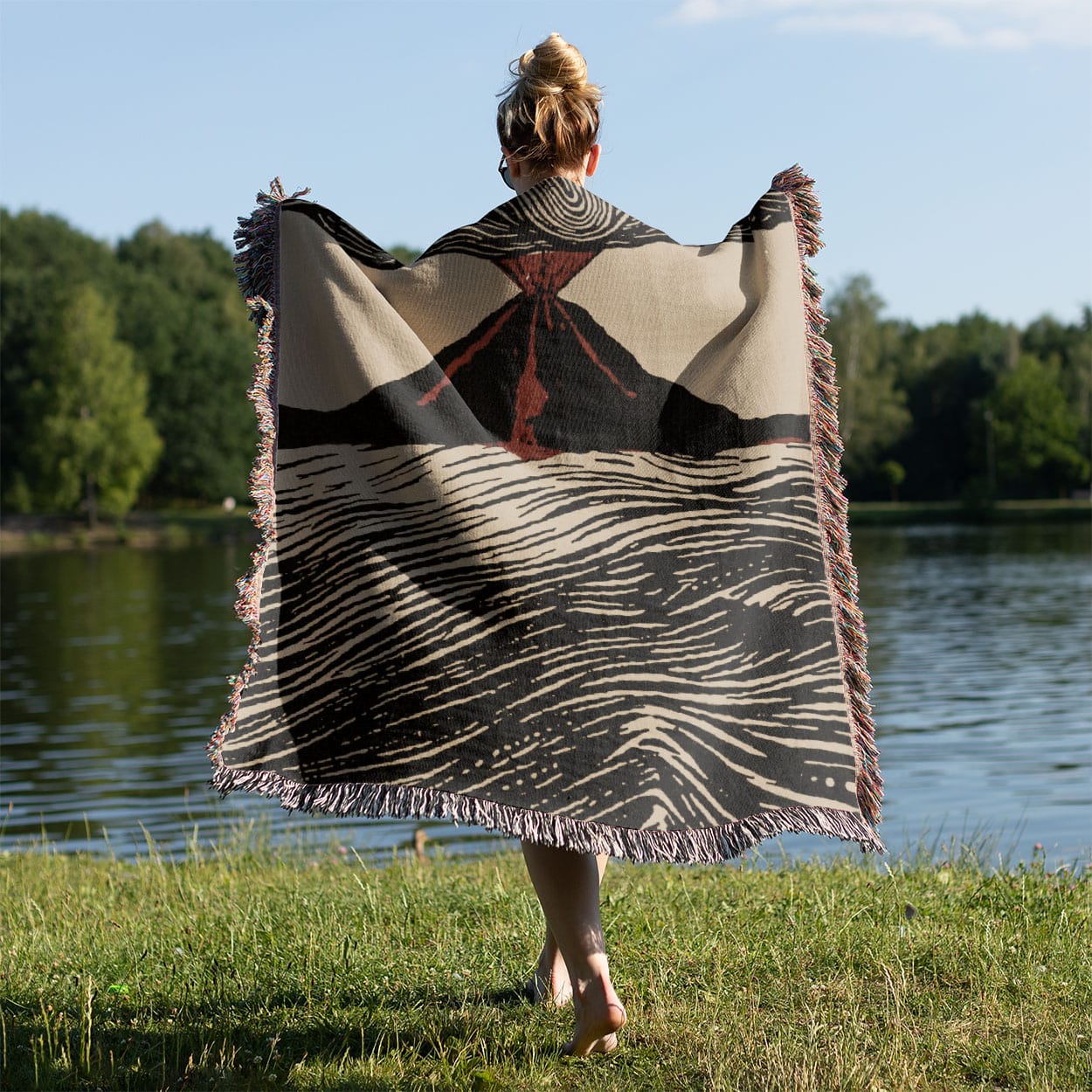 Cool Volcano Drawing Woven Blanket Held on a Woman's Back Outside