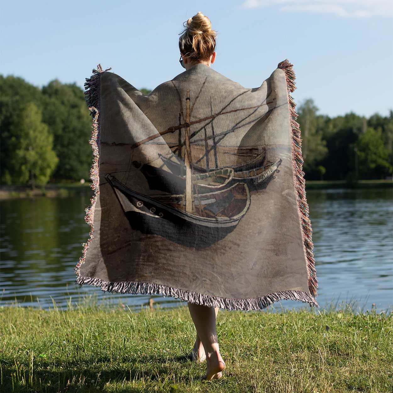 Costal Woven Throw Blanket Held on a Woman's Back Outside