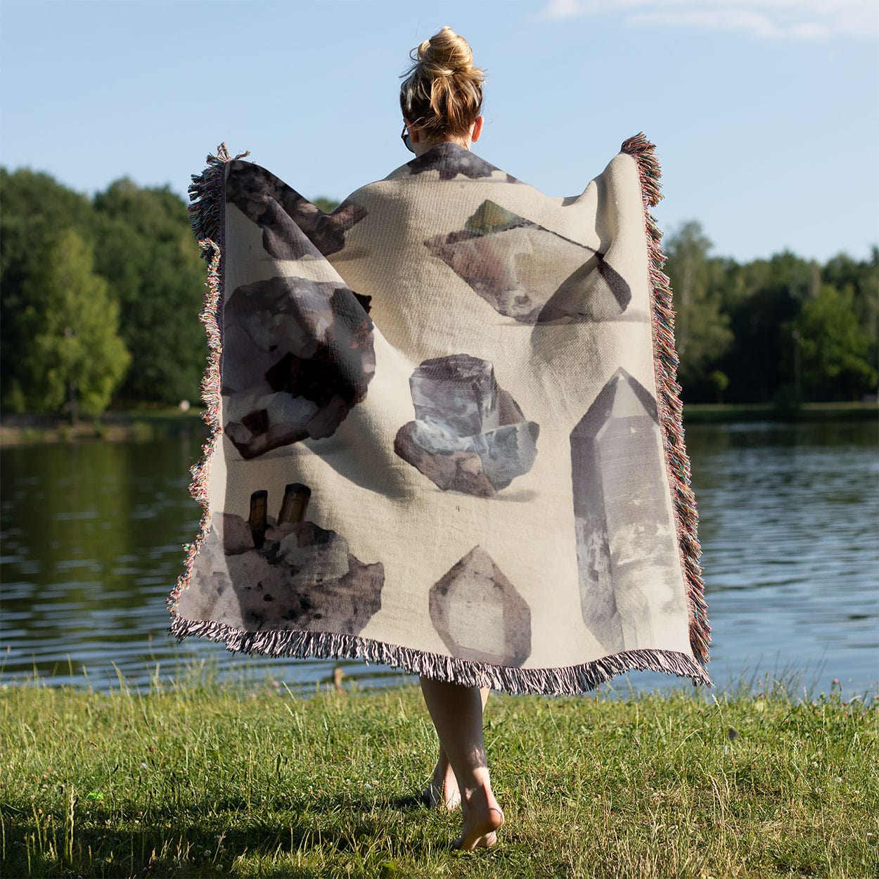 Crystals and Gemstones Woven Throw Blanket Held on a Woman's Back Outside