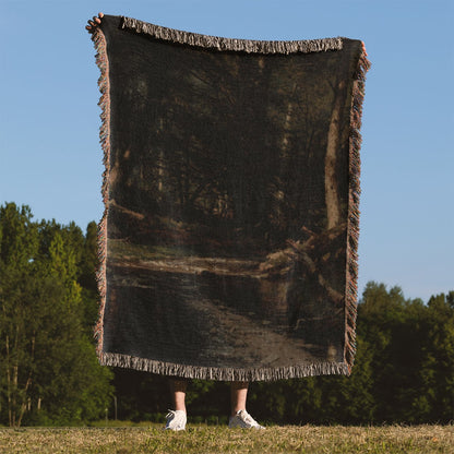 Dark Forest Woven Throw Blanket Held Up Outside