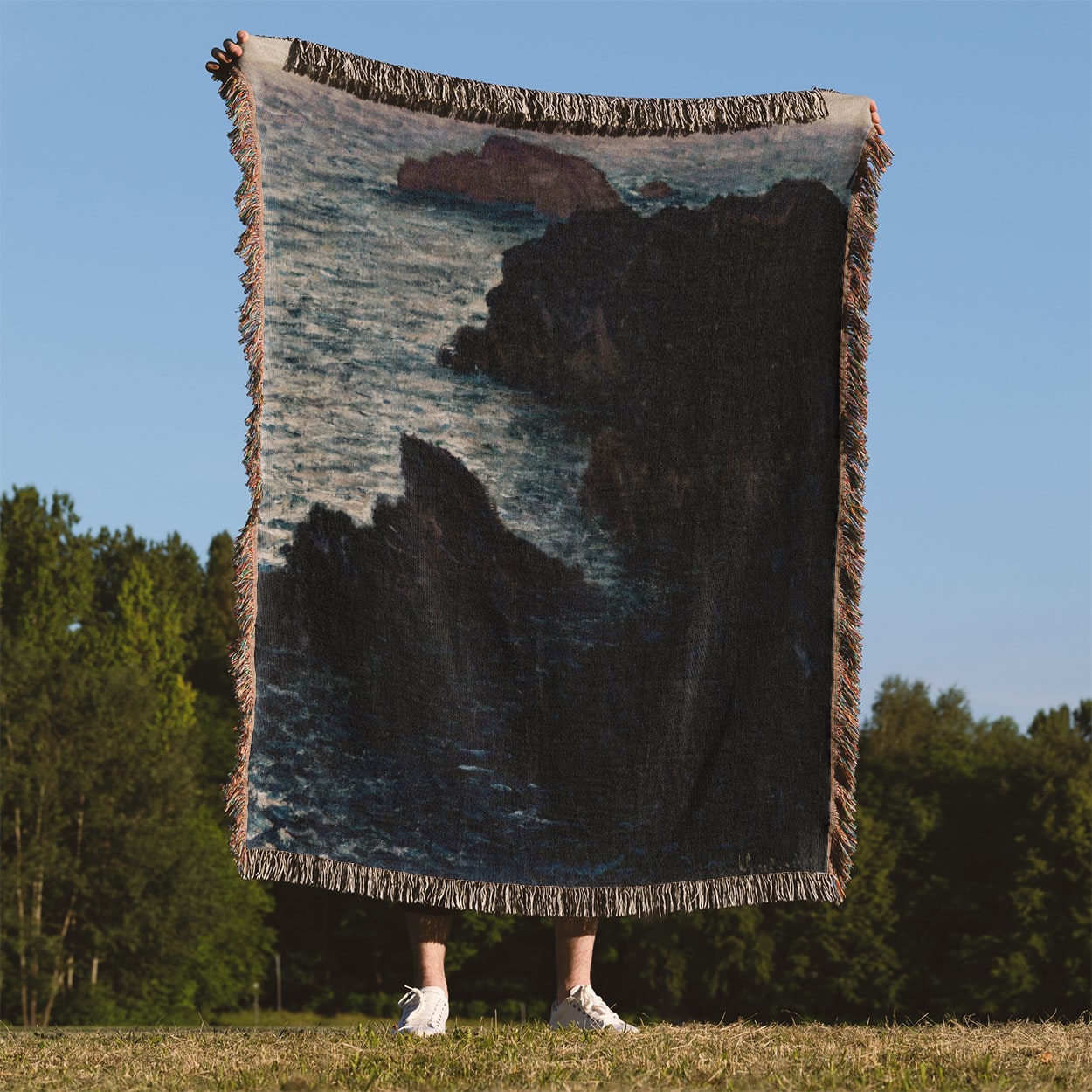 Dark Sea Woven Blanket Held Up Outside