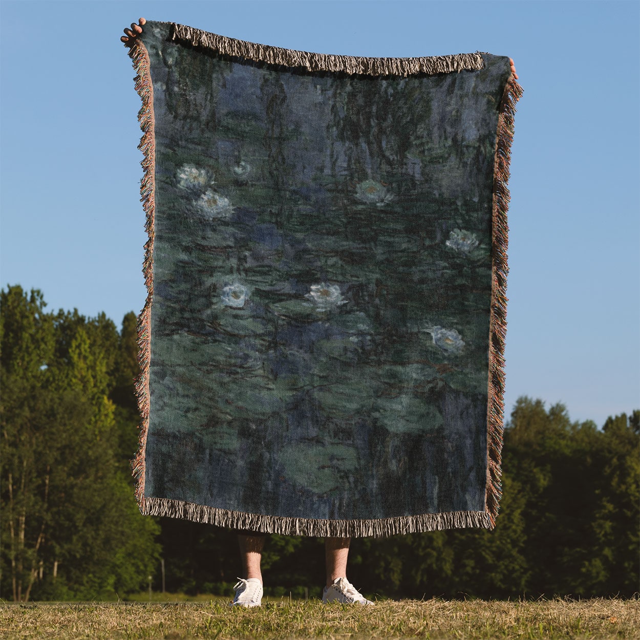 Deep Blue and Green Woven Blanket Held Up Outside