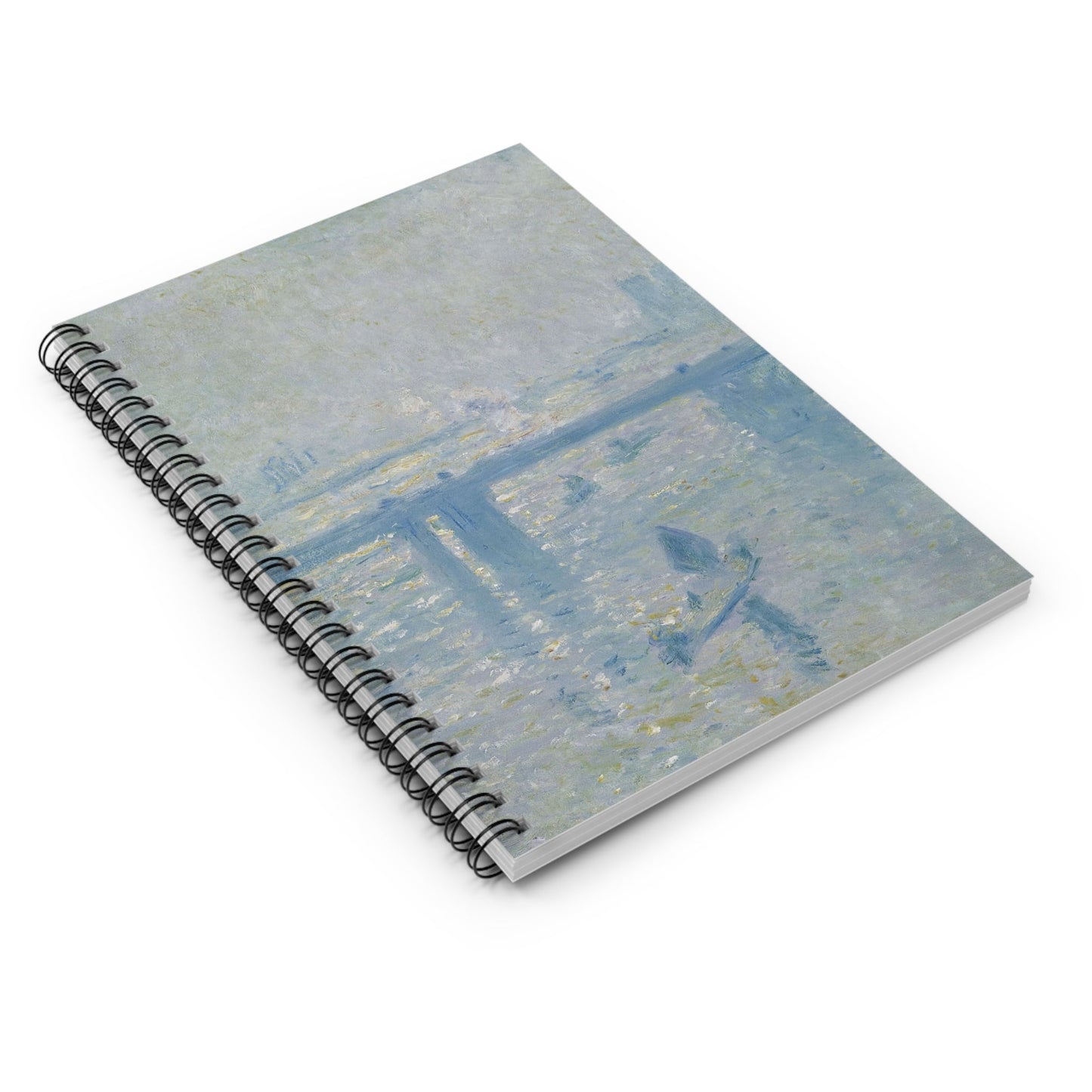 Dusty Light Blue Spiral Notebook Laying Flat on White Surface