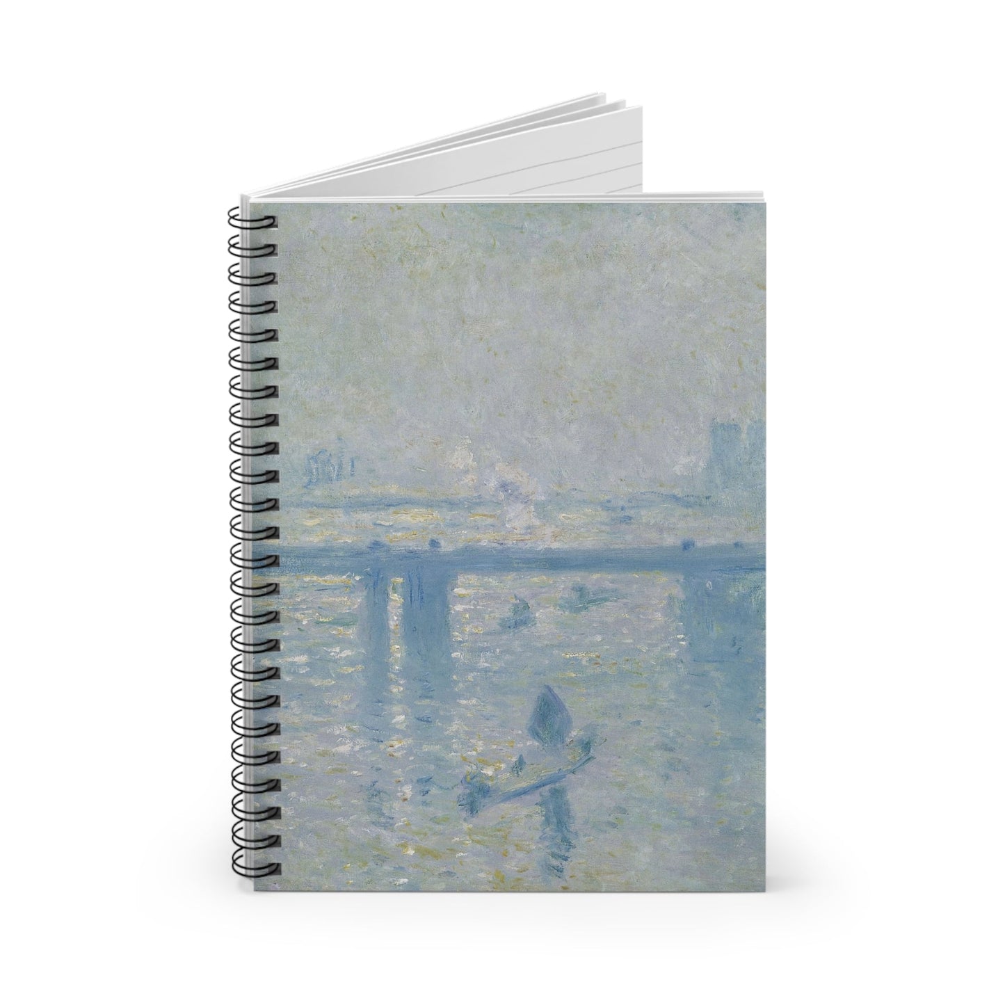 Dusty Light Blue Spiral Notebook Standing up on White Desk