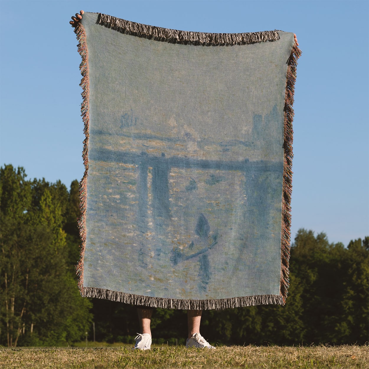 Dusty Light Blue Woven Throw Blanket Held Up Outside