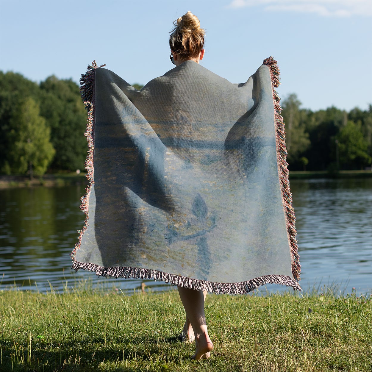 Dusty Light Blue Woven Throw Blanket Held on a Woman's Back Outside