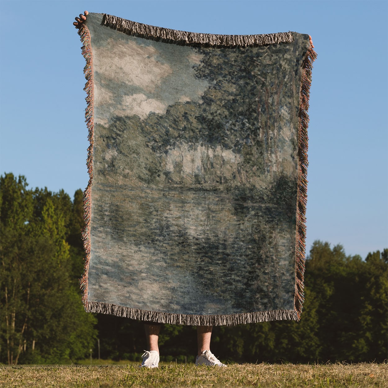 Dusty Sage Landscape Woven Throw Blanket Held Up Outside