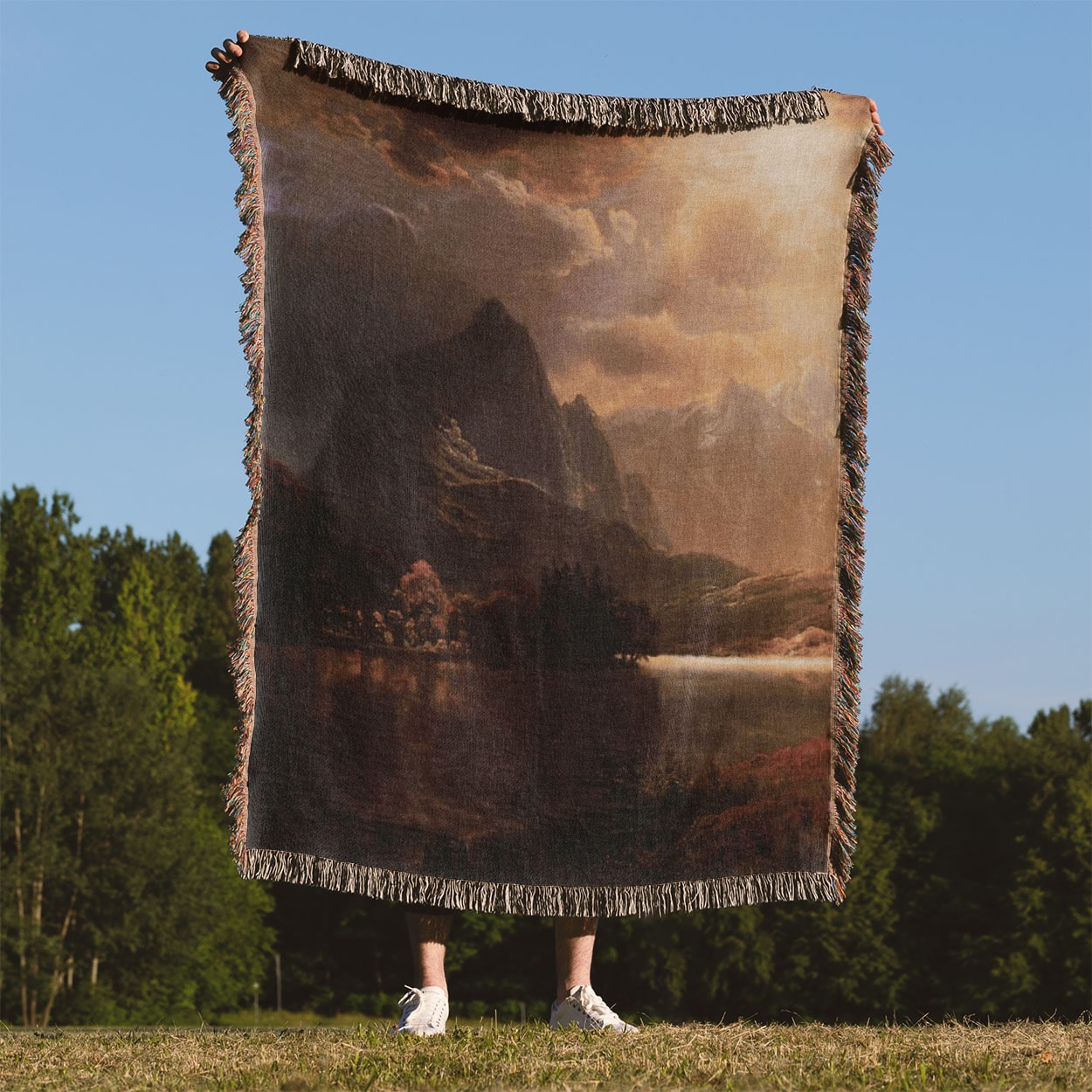 Ethereal Mountains Woven Throw Blanket Held Up Outside