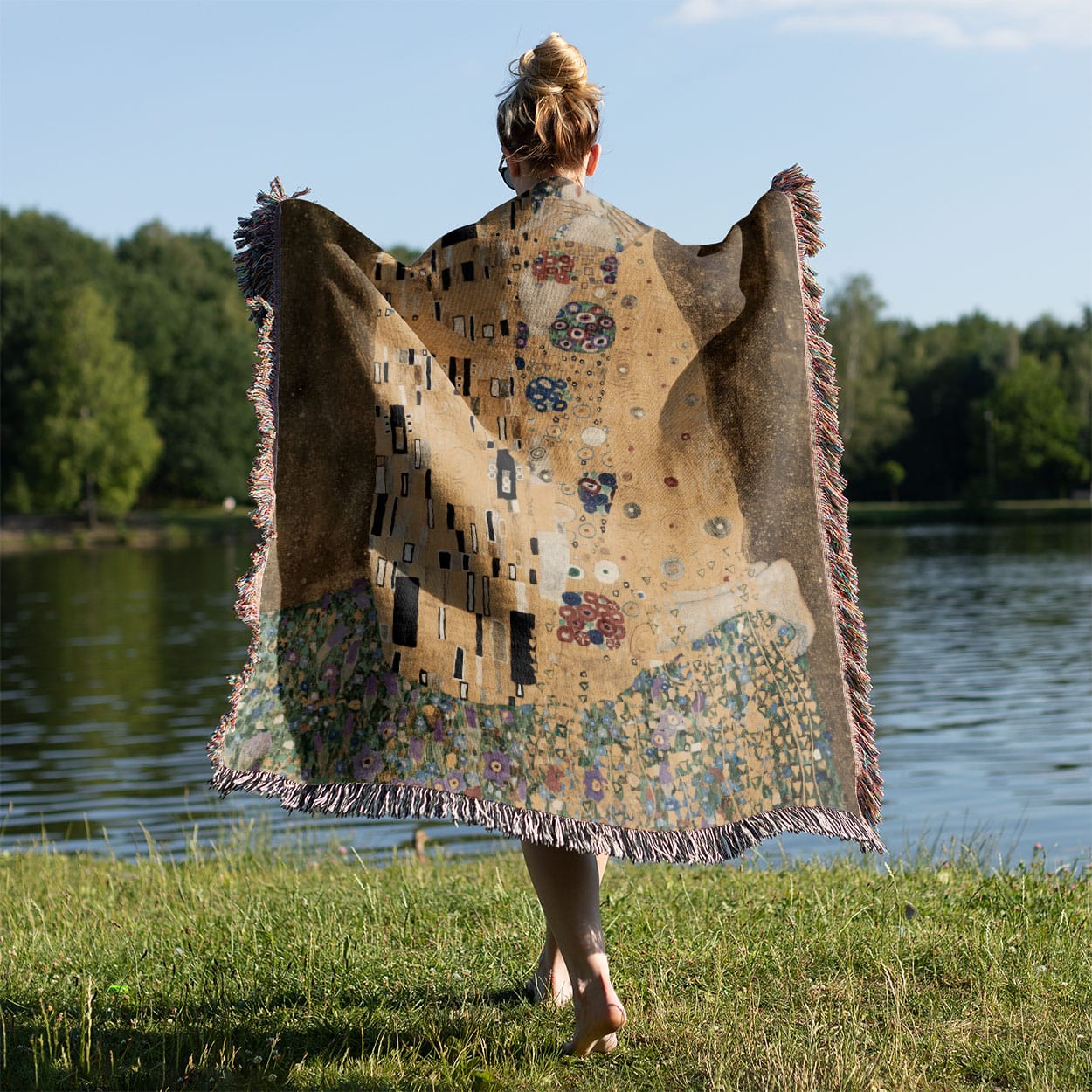 Famous Kissing Woven Blanket Held on a Woman's Back Outside