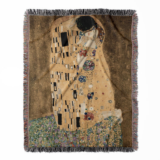 Famous Kissing woven throw blanket, made with 100% cotton, presenting a soft and cozy texture with "The Kiss" by Gustav Klimt for home decor.