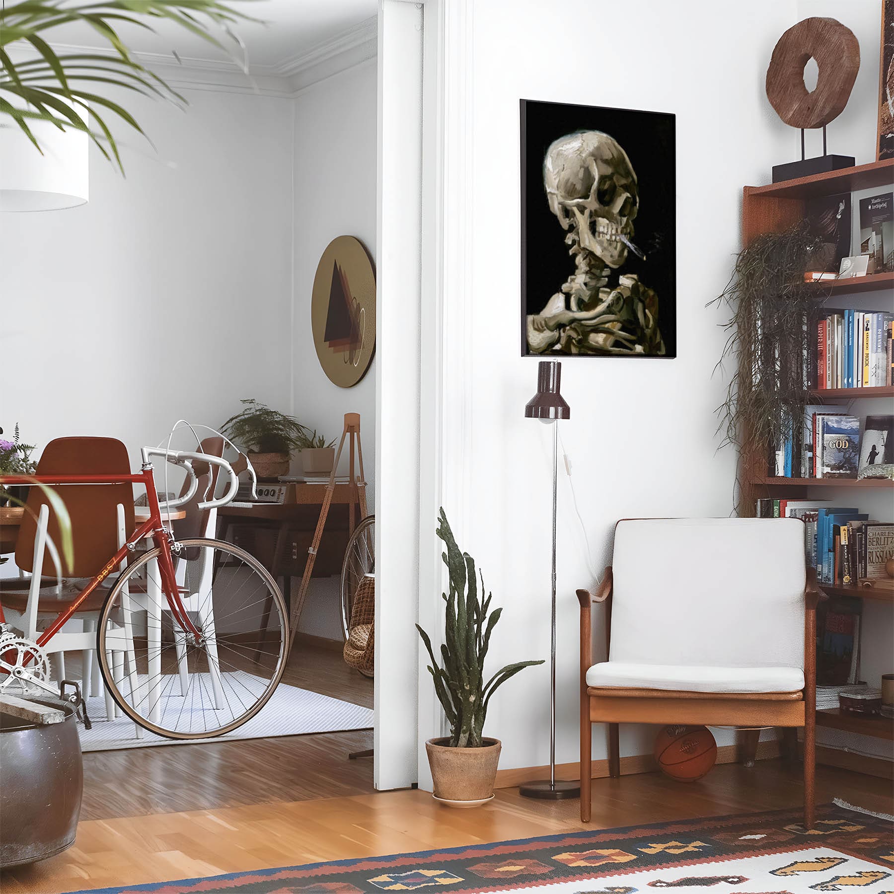 Eclectic living room with a road bike, bookshelf and house plants that features framed artwork of a Artsy Dark Smoking above a chair and lamp