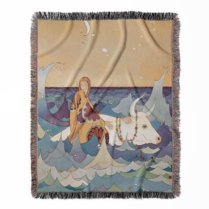 Fantasy Ocean woven throw blanket, made with 100% cotton, featuring a soft and cozy texture with a woman riding a bull in waves for home decor.