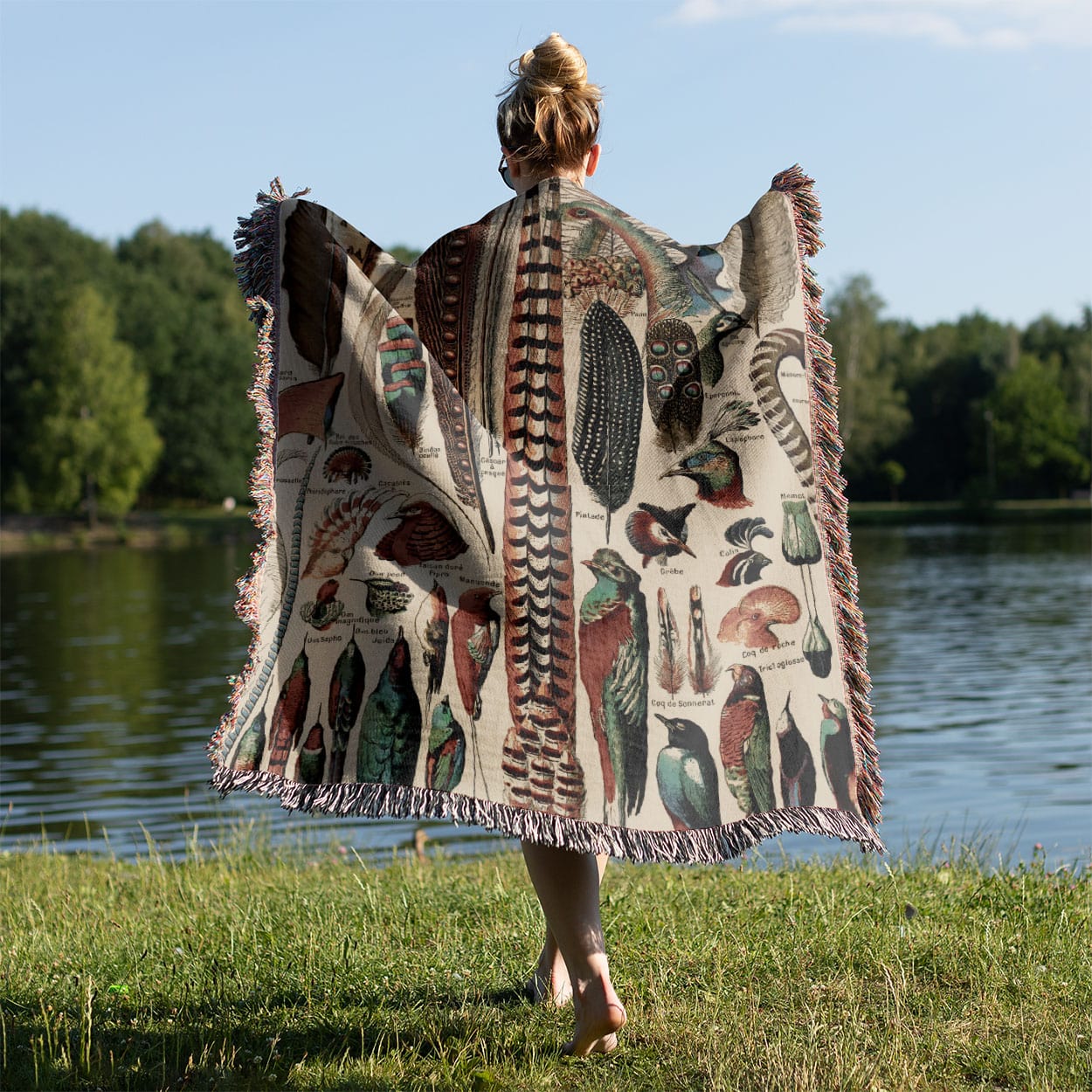 Feathers Woven Throw Blanket Held on a Woman's Back Outside